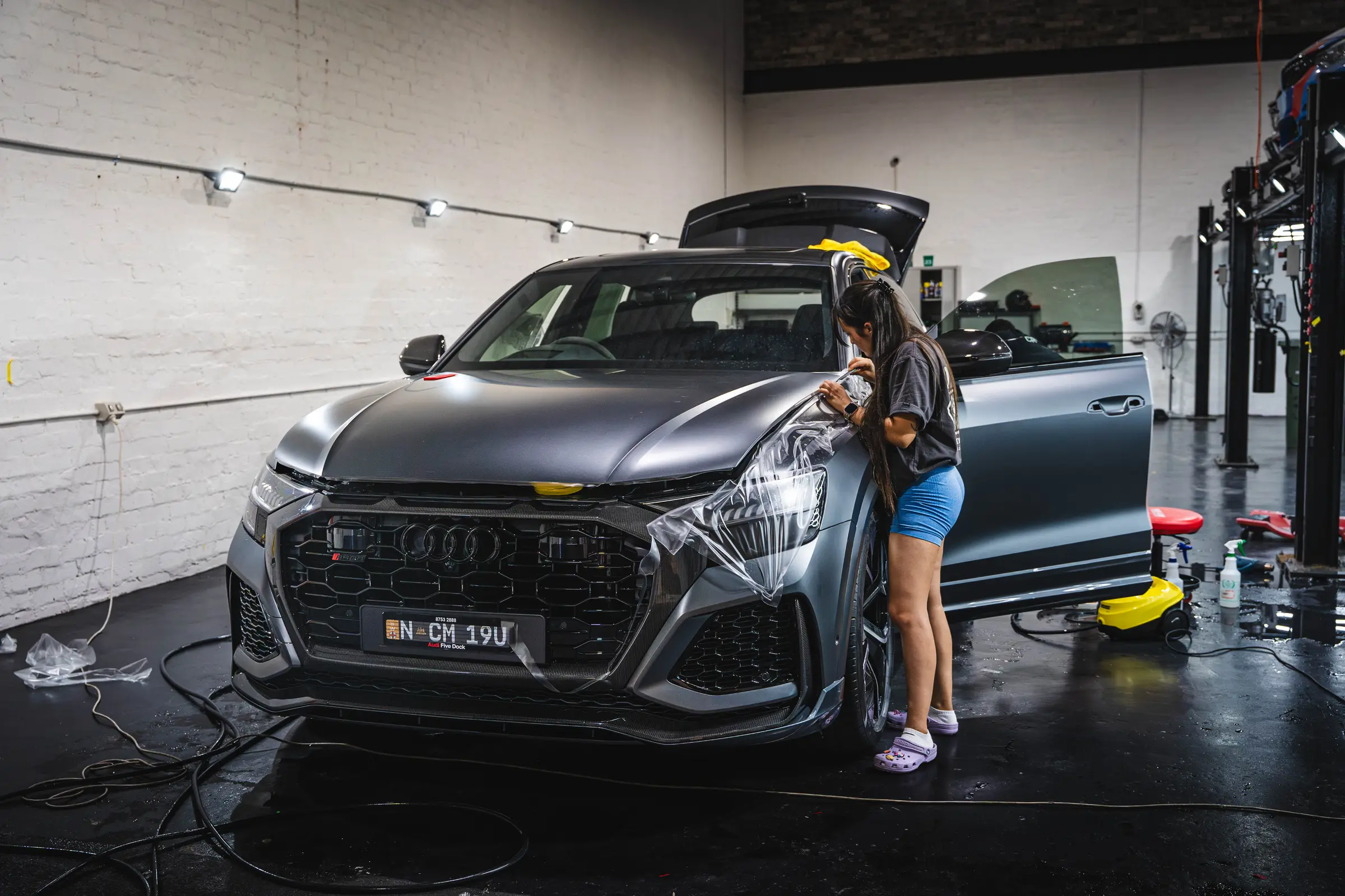 Satin black Audi RS Q8 in the Super Shine detailing bay
