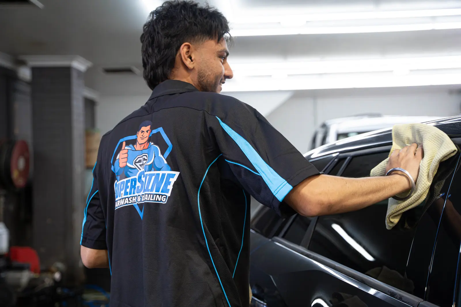 Super Shine technician detailing a vehicle